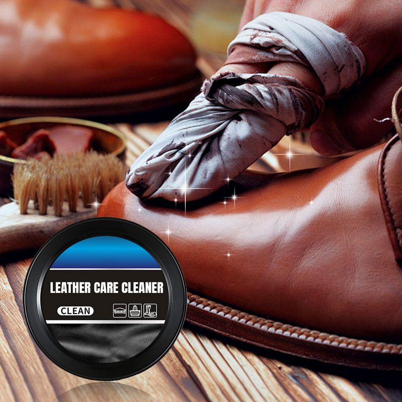 Arenzza leather cleaning and care cream with cleaning paste for leather maintenance, shown in a jar with a brush applicator.