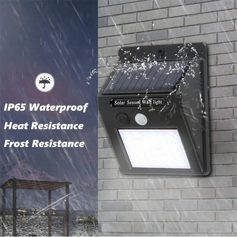 Arenzza solar powered motion sensor wall light mounted on a wall, illuminating a modern house exterior at dusk.