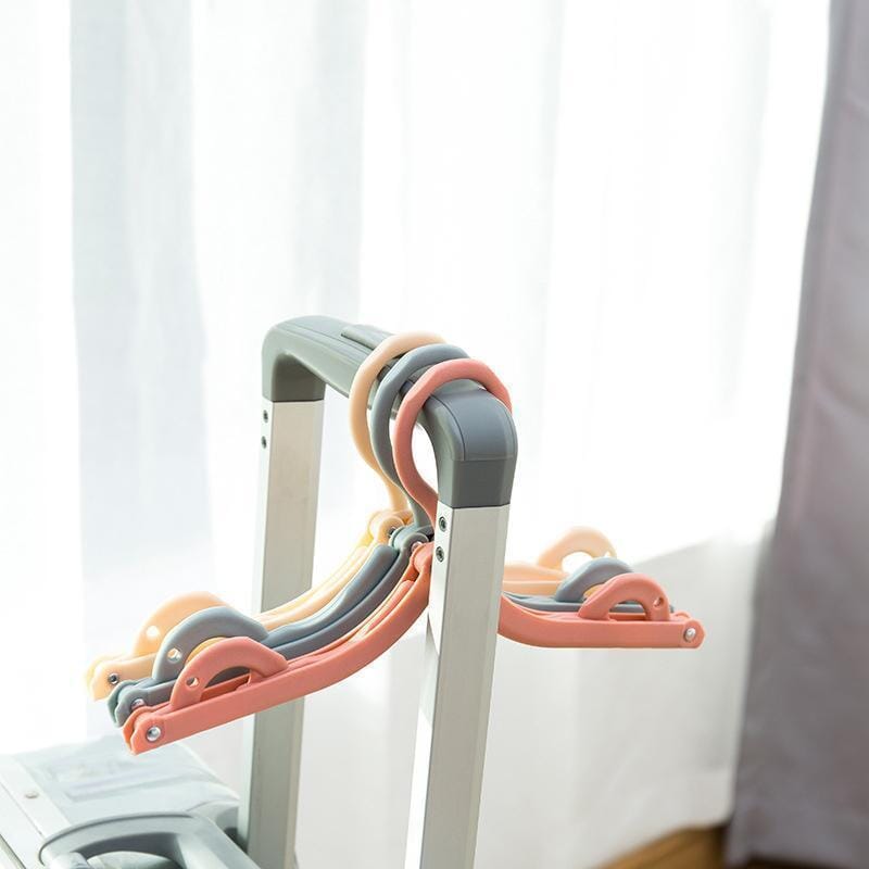 Arenzza foldable portable travel hanger, compact houseware and kitchen accessory, shown in an open and folded position.