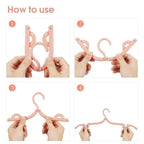 Arenzza foldable portable travel hanger shown in a compact, open position, ideal for travel and houseware organization.