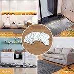 Heart-shaped Arenzza reusable non-slip rug grippers on a kitchen floor to prevent slipping and secure rugs.