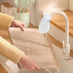 Arenzza anti-splash kitchen faucet filter attached to a modern kitchen sink, designed for sediment and rust removal.