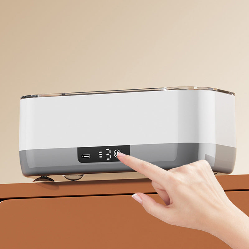 Arenzza portable smart ultrasonic cleaner with a stainless steel basin and digital controls, designed for household and kitchen use.