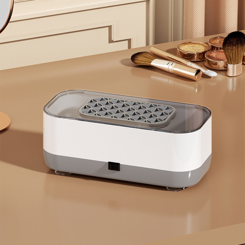 Arenzza portable smart ultrasonic cleaner for household use, showing a compact device with digital display and stainless steel tank.