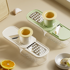 Arenzza 3-in-1 mandoline slicer with container for slicing vegetables and fruits in a kitchen setting.