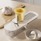 Arenzza 3-in-1 mandoline slicer with container for kitchen prep, featuring adjustable blades and a safety hand guard.