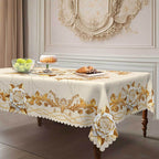 A waterproof gold rose tablecloth by Arenzza, showcasing a luxurious floral design on a smooth, protective kitchen and houseware fabric.