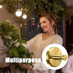 A stainless steel suction cup hook attached to a wall, holding a Christmas wreath in a kitchen or houseware setting.