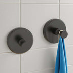 Arenzza stainless steel suction cup hook attached to a wall, holding a Christmas wreath for houseware and kitchen use.