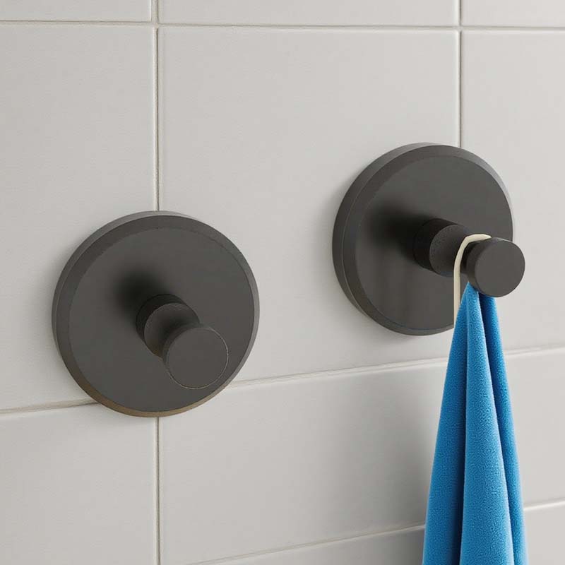 Arenzza stainless steel suction cup hook attached to a wall, holding a Christmas wreath for houseware and kitchen use.