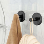 Arenzza stainless steel suction cup hook attached to a wall, holding a Christmas wreath in a houseware and kitchen setting.