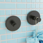 Arenzza stainless steel suction cup hook attached to a wall holding a Christmas wreath in a houseware and kitchen setting.
