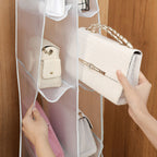 Arenzza hanging handbag dust-proof organizer with 6 large pockets for storing and organizing handbags in the house or kitchen.