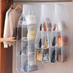 Arenzza hanging handbag dust-proof organizer with 6 large pockets for storing handbags and accessories in the house or kitchen.