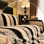 A soft plush Arenzza non-slip couch cover draped over a sofa, showcasing its cozy texture and secure fit for houseware and kitchen use.