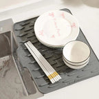 Arenzza no-spill silicone worktop saver mat with heat-resistant, non-slip surface for drip-free drying in kitchen or houseware setting.