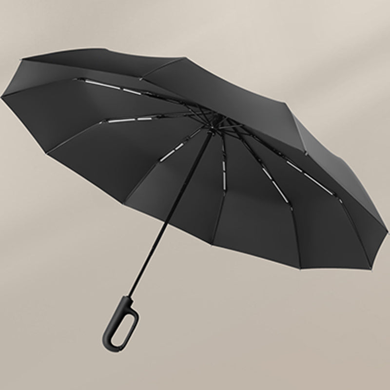 Aarenza folding sun umbrella for rain and sunshine, compact and black, with a handle and open canopy showing sun and rain symbols.