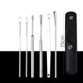 Aarenza portable 6-piece stainless steel ear piercing kit with spiral ear tool, including various needles and tools for ear piercing.
