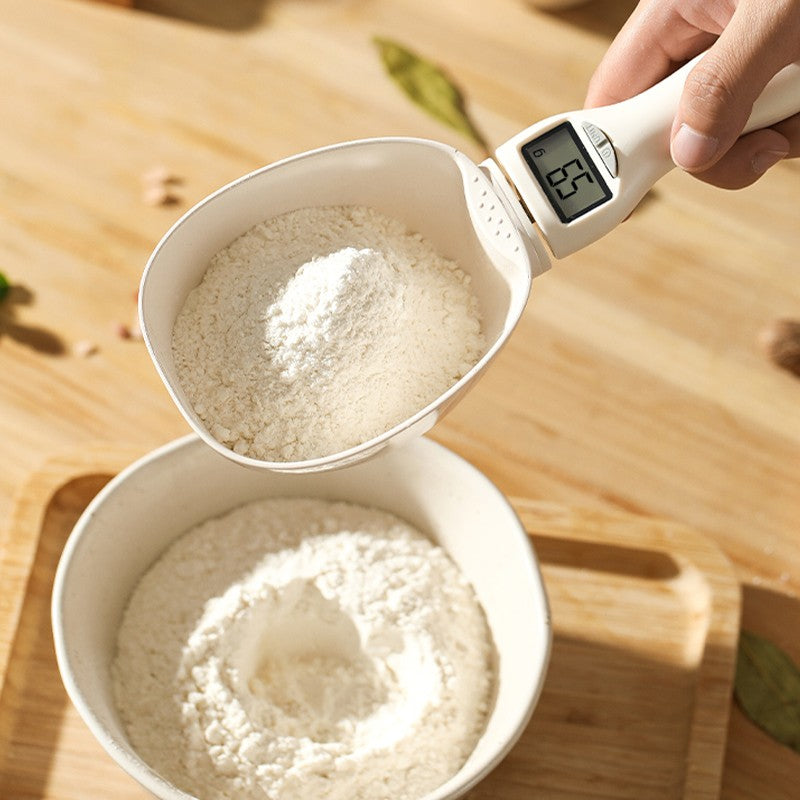 Arenzza electronic digital food spoon with digital display, stainless steel handle, and measurement buttons on a kitchen countertop.