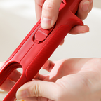 Arenzza multi-purpose anti-scald bowl holder clip for kitchen, shown securing a bowl to prevent burns and spills.