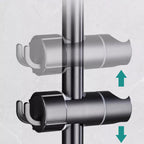Arenzza tool-free shower holder mounted on a bathroom wall, holding a showerhead in a modern houseware and kitchen setting.