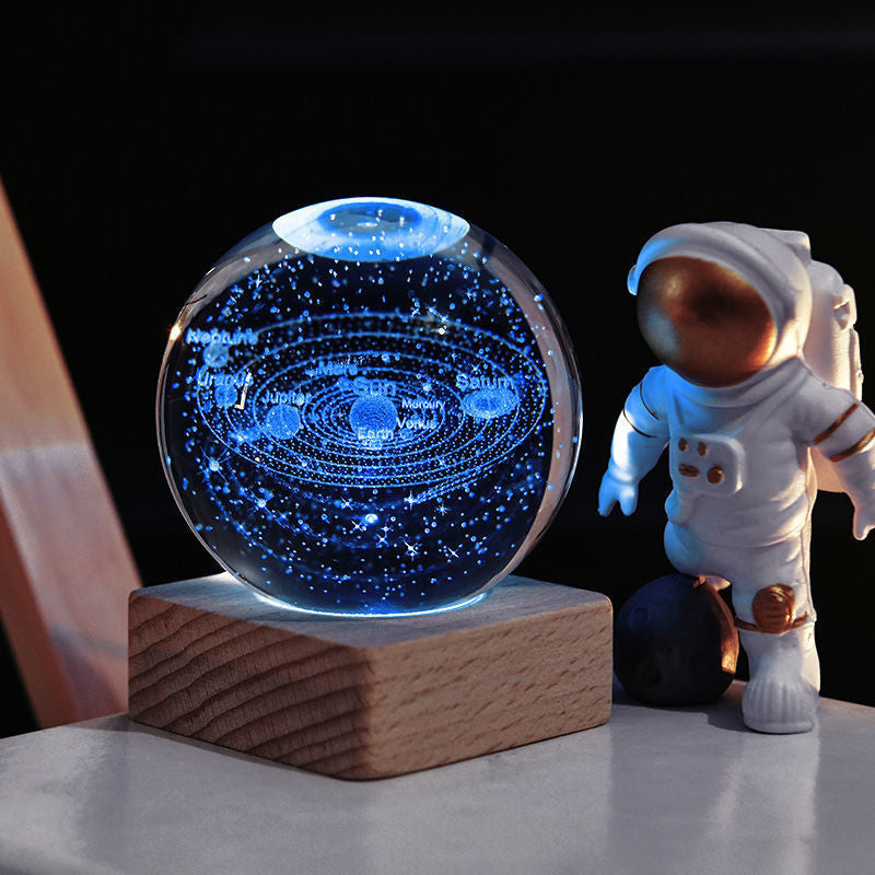 Arenzza 3D Galaxy Crystal Ball Nightlight in a houseware setting, showcasing a luminous galaxy design as a decorative lamp.
