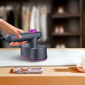 Arenzza portable mini steam iron for houseware and kitchen use, compact design with a handle and steam nozzle visible.