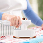 Aarenza portable mini steam iron for houseware and kitchen use, shown with steam ready for clothing or fabric ironing.