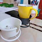 Arenzza clip-on desk cup holder attached to a desk, holding a coffee mug in a houseware and kitchen setting.