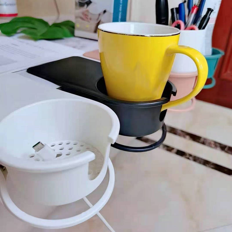 Arenzza clip-on desk cup holder attached to a desk, holding a coffee mug in a houseware and kitchen setting.