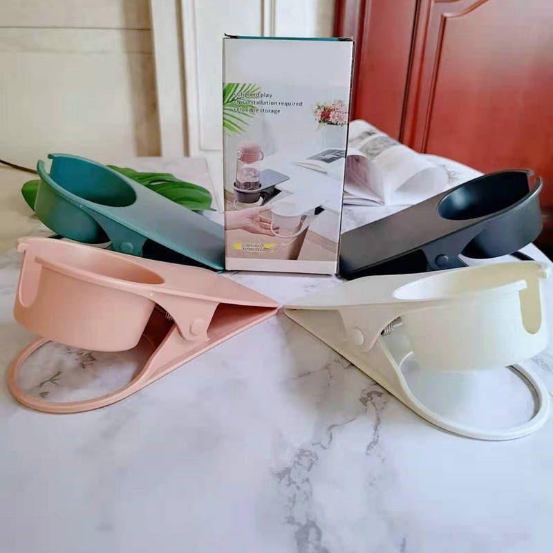 Arenzza clip-on desk cup holder attached to a desk, holding a coffee mug, designed for houseware and kitchen organization.