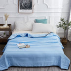 Arenzza ice cooling calming blanket in light blue, designed for summer sleep comfort, soft fabric with textured surface