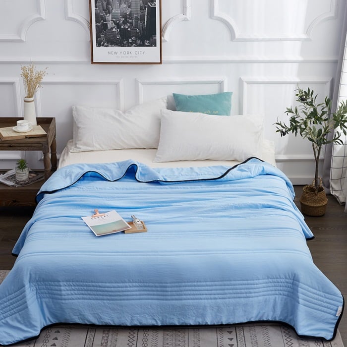 Arenzza ice cooling calming blanket in light blue, designed for summer sleep comfort, soft fabric with textured surface