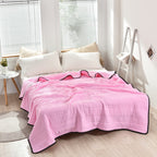 Arenzza ice cooling calming blanket on a bed, showcasing its soft, lightweight fabric designed for summer sleep comfort.