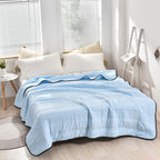 Arenzza ice cooling calming blanket in summer, shown spread out on a bed, designed for peaceful, refreshing sleep.