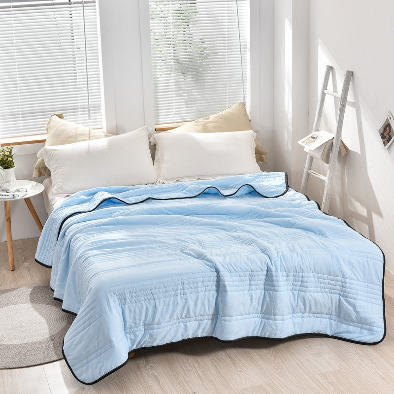 Arenzza ice cooling calming blanket in summer, shown spread out on a bed, designed for peaceful, refreshing sleep.