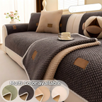 Aarenza thickened non-slip washable sofa cover on a sofa, showcasing its textured fabric and secure fit for houseware and kitchen use.