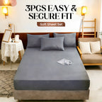 Arenzza 3-piece soft sheet set with easy secure fit, shown on a bed with neatly arranged pillows and bedding in a cozy bedroom setting.