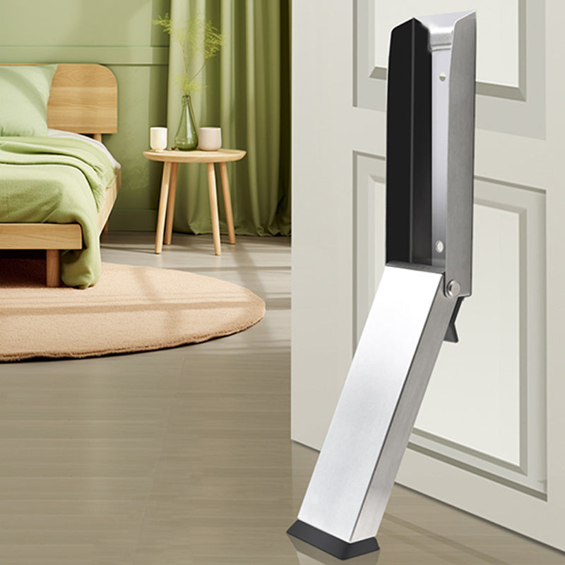 Arenzza magnetic stainless steel door stopper attached to a door and wall in a modern kitchen setting.