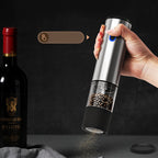 Arenzza electric pepper and salt grinder set in stainless steel and glass, with adjustable grind settings, on a kitchen countertop.