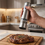 Arenzza electric salt and pepper grinder set on a kitchen countertop, featuring sleek stainless steel design and adjustable grinding mechanisms.