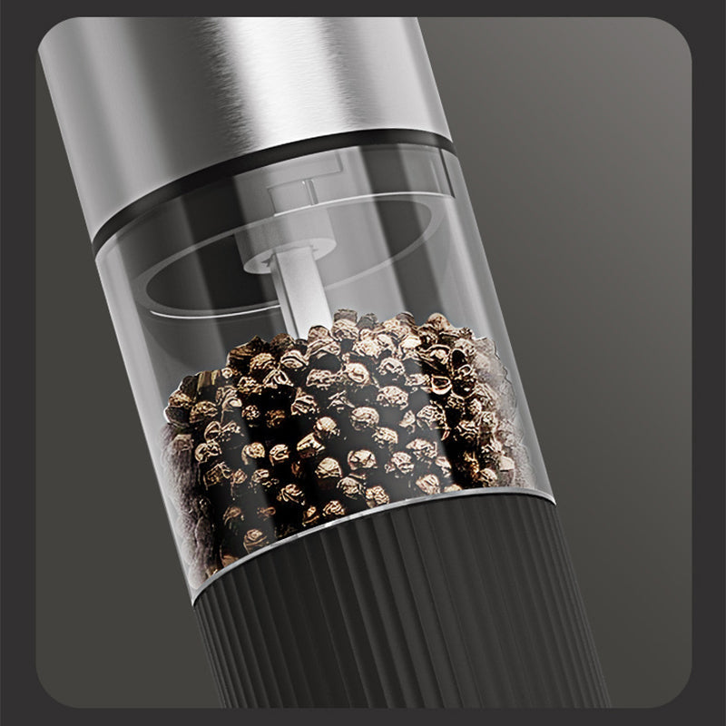 Arenzza electric pepper and salt grinder set in black and silver, with stainless steel grinding mechanisms on a kitchen countertop.