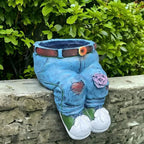 A 3D jeans-shaped flower pot by Arenzza, designed for houseware and kitchen decor, with vibrant fabric texture and floral accents.