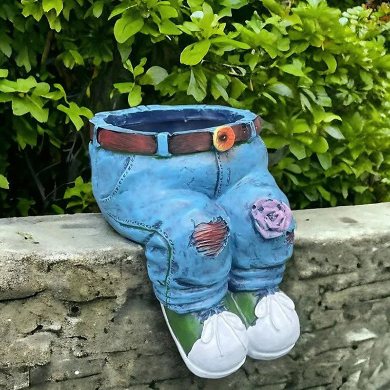 A 3D jeans-shaped flower pot by Arenzza, designed for houseware and kitchen decor, with vibrant fabric texture and floral accents.