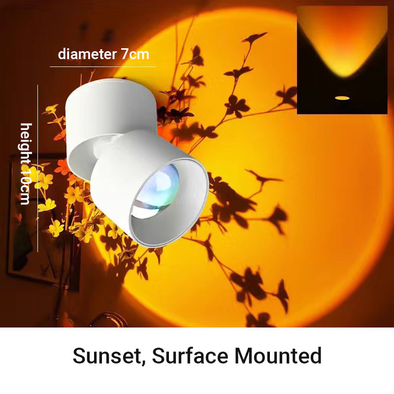 Arenzza LED Sunset Projection Lamp casting warm sunset light, perfect for photography, parties, and home decor in bedroom or living space.