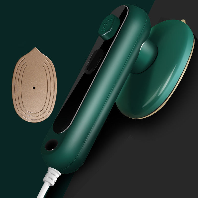 Aarenza Mini Portable Handheld Steamer for clothes, compact houseware device with water tank and steam outlet in a kitchen setting.