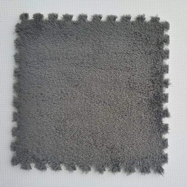 Arenzza plush patchwork foam floor mat with colorful rectangular sections for houseware and kitchen use.
