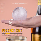 Arenzza DIY whisky ice balls in a clear glass, showcasing slow-melting ice spheres for enhancing whiskey tasting experience.