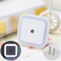 Arenzza LED smart light control sensor for energy-saving lamps, mounted on a wall in a modern kitchen setting.