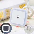 Arenzza LED smart light control sensor for energy-saving lamps, mounted on a wall in a modern kitchen setting.
